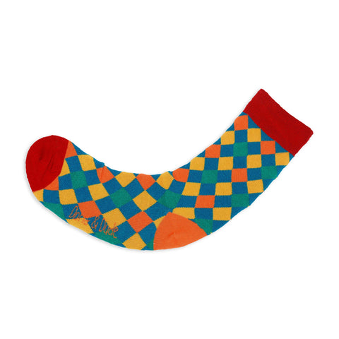 An image of a Teal Harlequin calf length sock by Doris & Dude